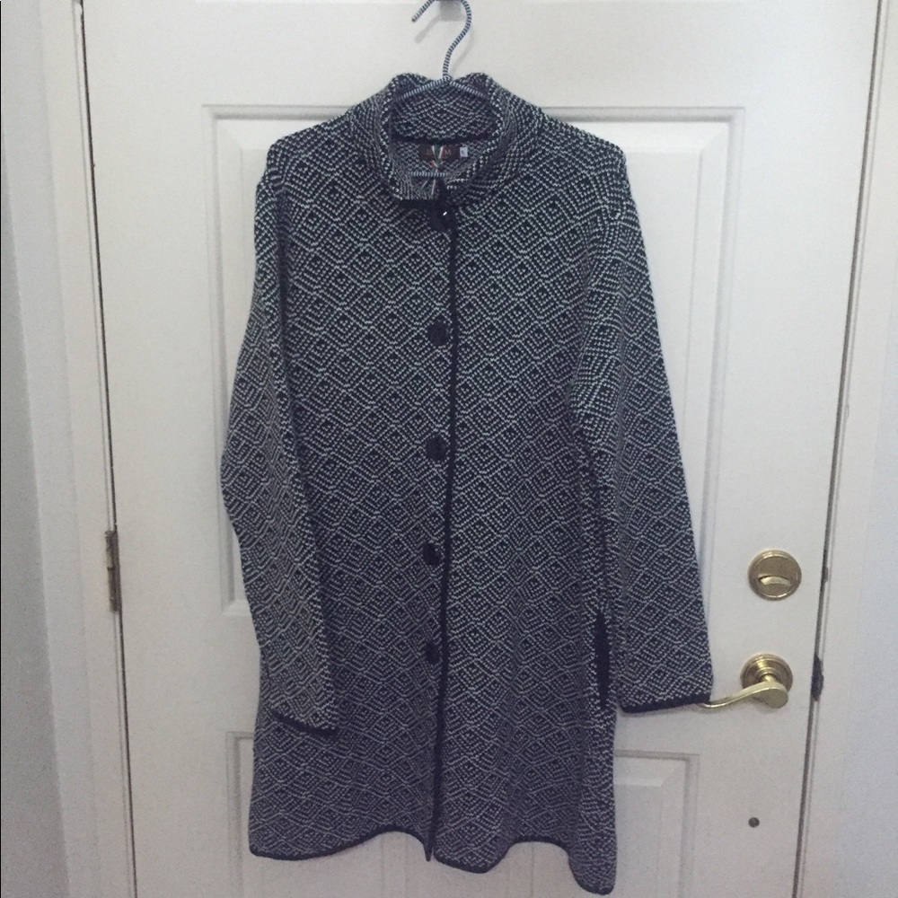 Sweater coat made in Italy. 70% Acrylic 30% wool.
